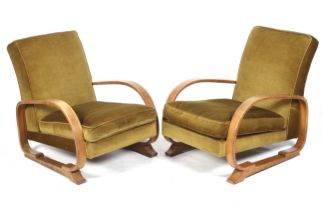A pair of 1930s tank armchairs.