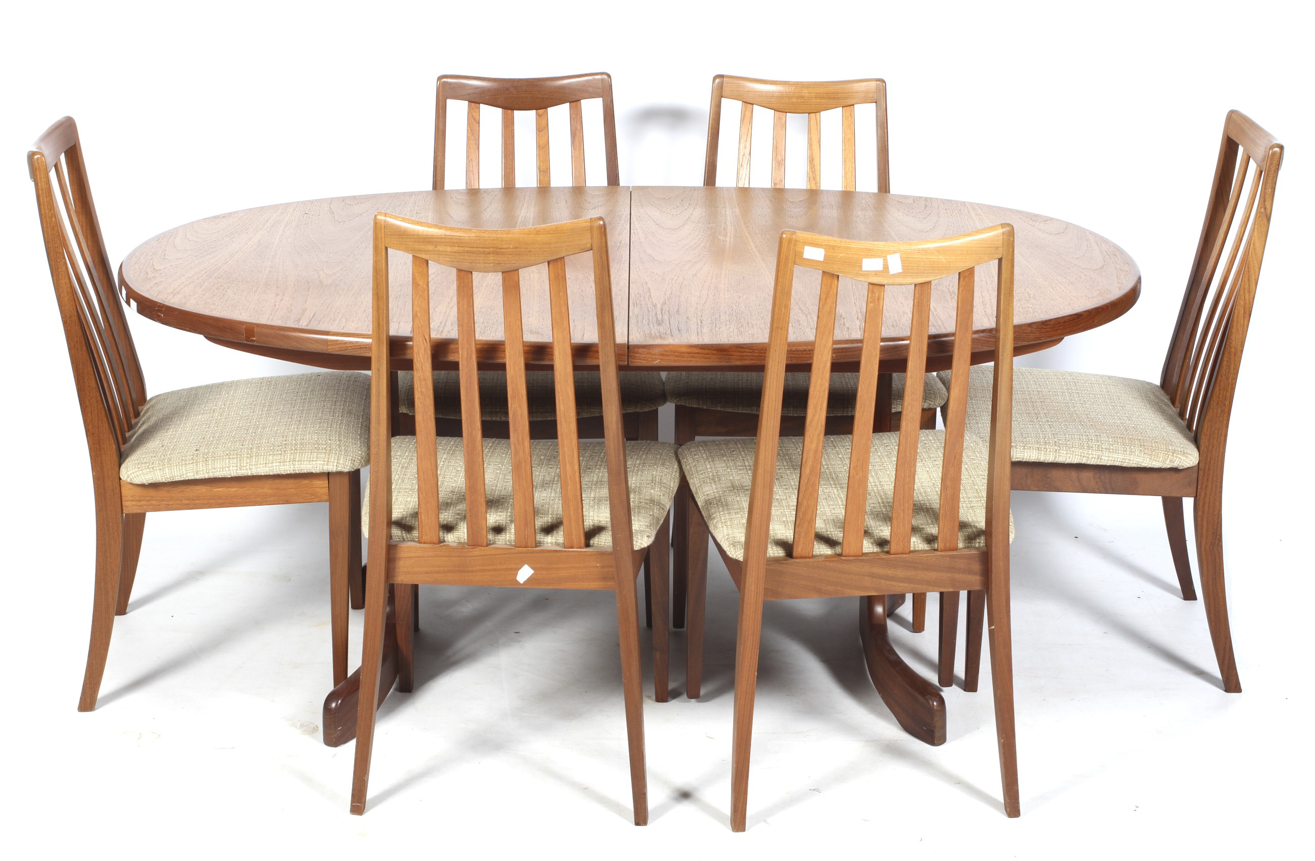 A mid-1970s G-Plan Fresco oval extending dining table and six chairs.