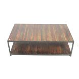 A contemporary metal framed and wood topped rectangular coffee table.