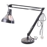 A mid-century anglepoise desk lamp. On a weighted circular base. 100cm fully extended.