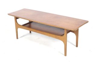 A mid-century teak coffee table.