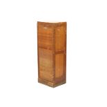 A mid-century teak tambour fronted cabinet.