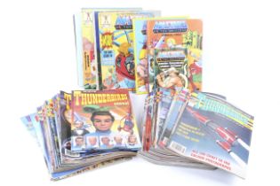 A collection of assorted Thunderbirds collectables.