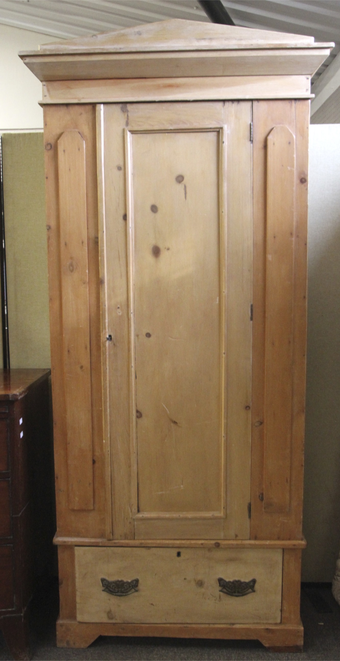 A vintage pine wardrobe.