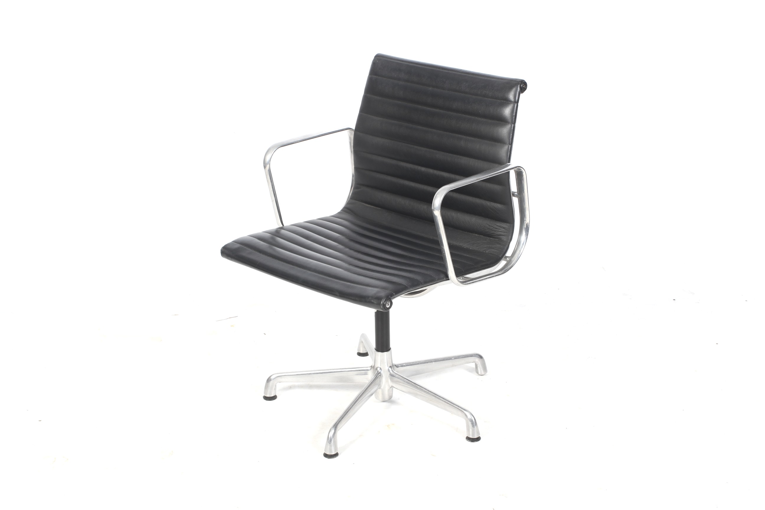 After Charles and Ray Eames, a low back swivel office chair.
