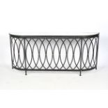 A contempoarary console table radiator guard with curved edges.