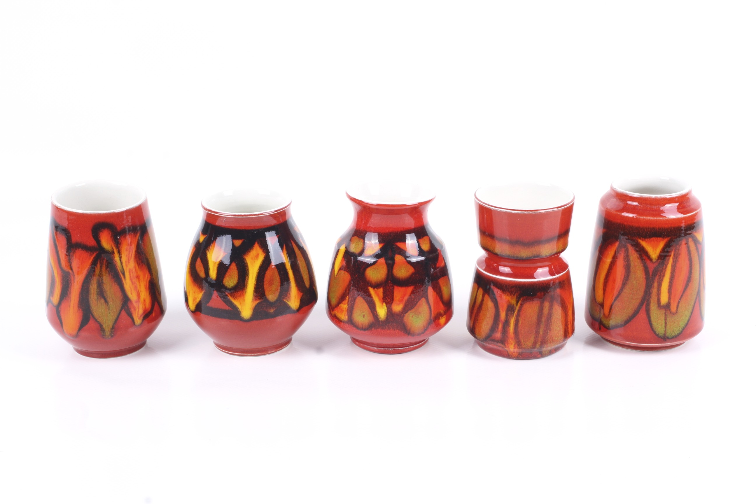 A collection of five small modern Poole Pottery Delphis vases. Various shapes. Max.