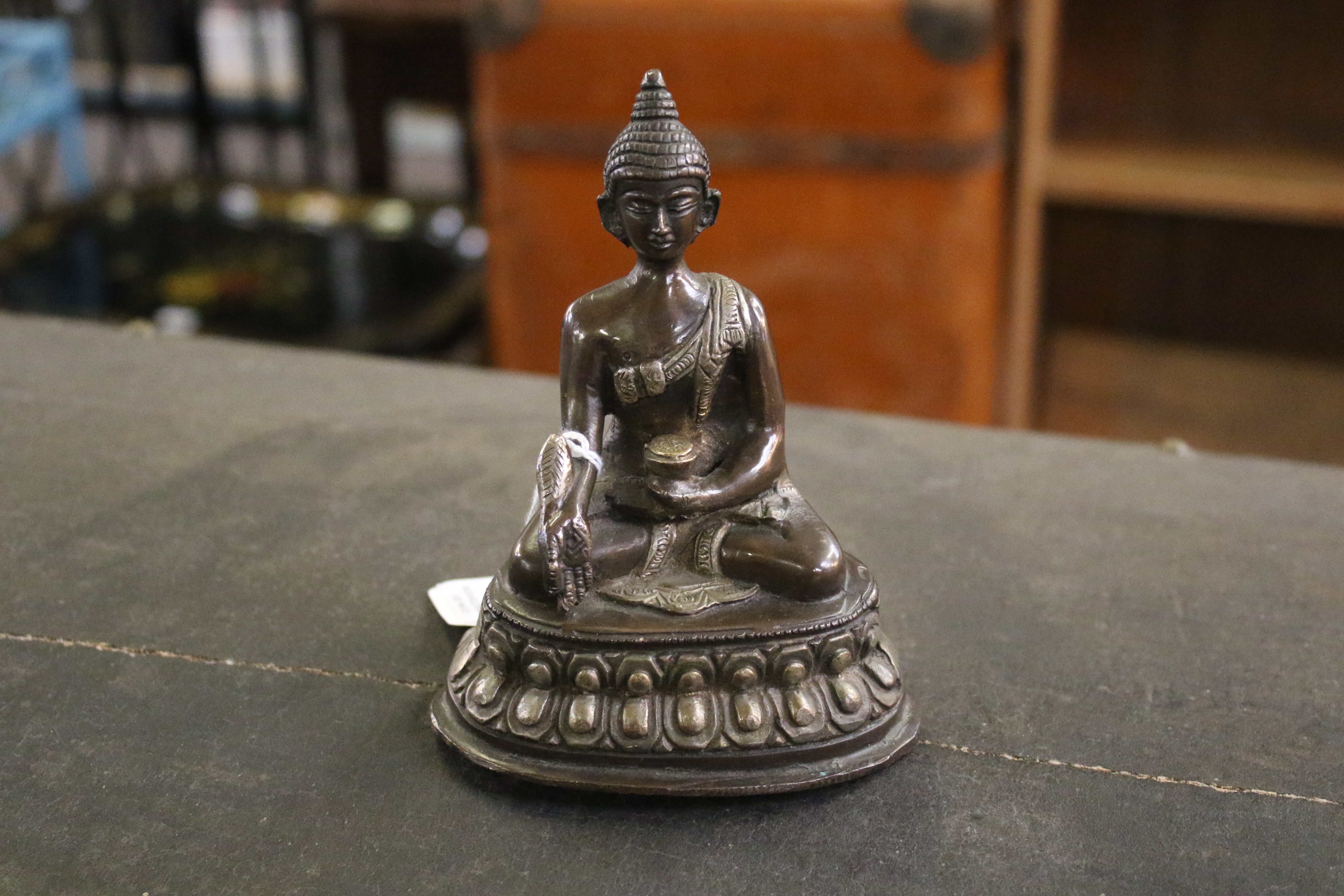 A Tibetan bronze figure of Buddha Shakyamuni with white metal inlay. - Image 3 of 8