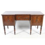 A Regency style mahogany inverted breakfront sideboard.