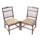 A pair of Edwardian mahogany chairs.