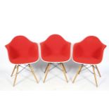 A set of three Charles and Ray Eames for Vitra armchairs.