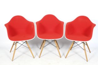 A set of three Charles and Ray Eames for Vitra armchairs.