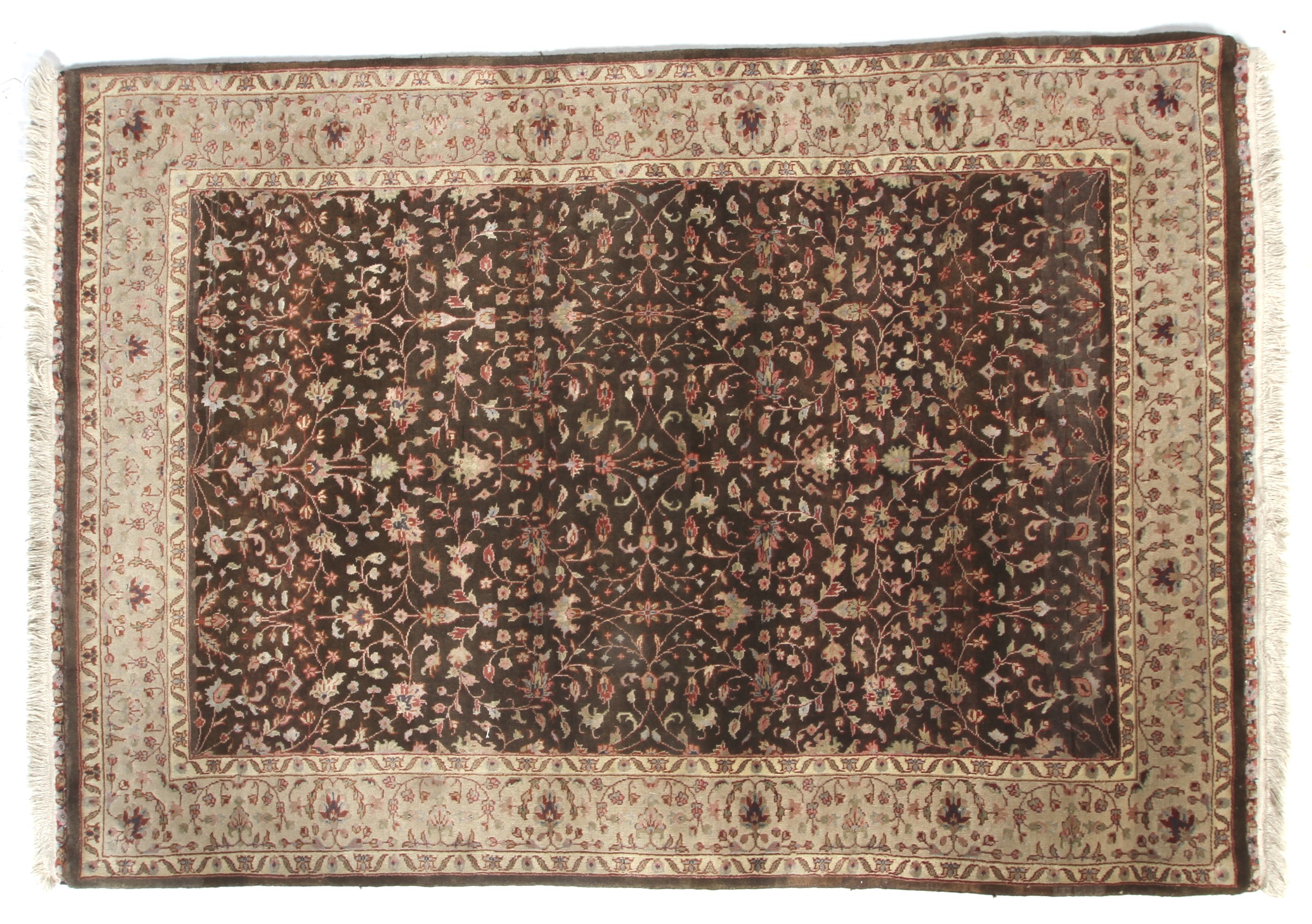 A Persian Tabriz brown ground wool rug with cream decoration.