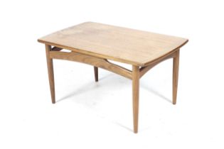 A 1960s period G-Plan Fresco teak coffee table. By designer Donald Gomme, red label on underside.