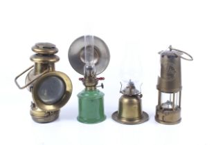 Four oil lamps. Comprising a Protector Lamp & Lighting Co.