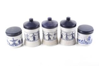 Five vintage Dutch blue and white plastic cigar jars.