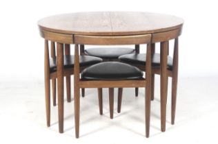 A 1960s Frem Rojle 'Roundette' extending teak table and five chairs by Hans Olsen.