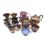 A collection of 20th century lustreware. Including a teapot, jugs, a tankard, goblet, etc.