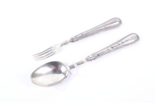 A Victorian silver christening fork and spoon with beaded handles.