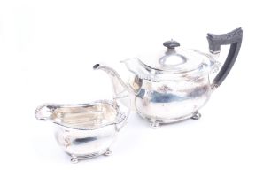 A Scottish silver oblong tea pot and milk jug.
