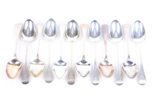 Twelve George III and later silver old English pattern table spoons.