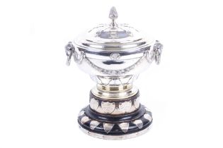 A silver trophy bowl and cover with a gilt interior.