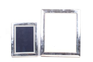 Two vintage silver mounted rectangular picture frames.