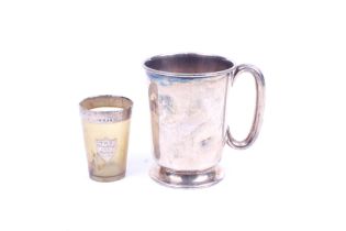 A silver mug and a small horn beaker; The half-pint mug with a loop handle,