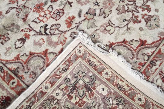 A 20th century rug. Cream ground rug with red decoration. - Image 2 of 5