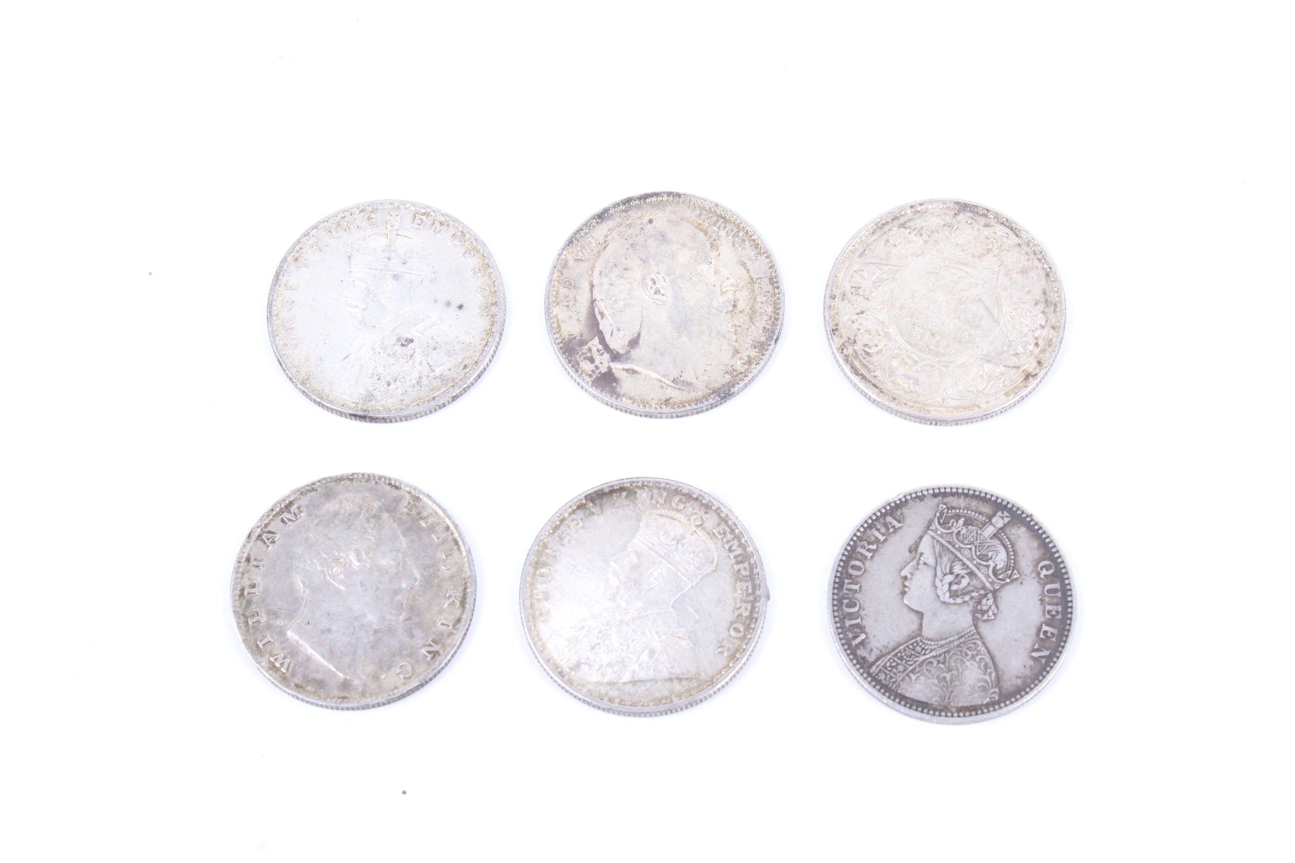 A group of six Indian Rupees coins. Dated 1835; 1862; 1907; 1913; 1918 ...