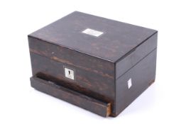 A Victorian c1860 Coromandel travelling box and a silver photograph frame.