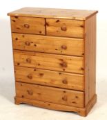A contemporary pine chest of drawers.