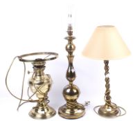 A group of three assorted brass lamps. Including a converted oil lamp, etc. Max.