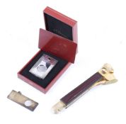 Three cigar cutters.