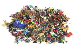 A large collection of assorted action figures toys. Including Dr.