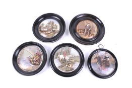 A group of five assorted framed prattware pot lids.
