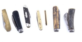 A collection of pen knives and razors.
