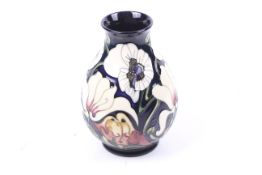 A contemporary Moorcroft Miss Alice pattern vase. Designed by Emma Bossons, circa 2005, 19cm high.