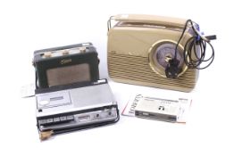 A vintage tape player and three radios.