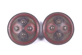 A pair of 19th/20th century small Indo-Persian dhal metal shields.