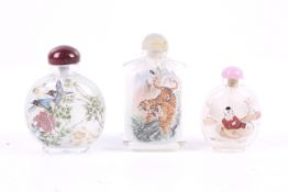 Three 20th century Chinese inside painted glass snuff bottles.