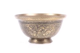 A large Tibetan yellow metal offerings bowl, possibly for water.