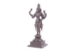 An Indian bronze figure of the goddess Lakshmi.