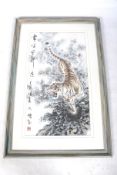 A Chinese or Korean painting on paper of a growling tiger. With an inscription and seal to the left.