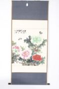 A 20th century large Chinese painting on paper of peonies and butterflies.