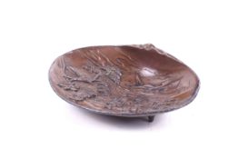 An early 20th century Japanese copper on pewter shell-shaped dish.