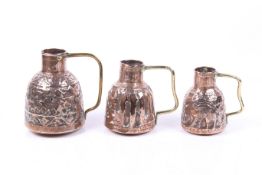 A set of three Islamic jugs.