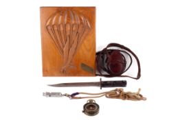 Selection of military related collectables including knife, whistle,