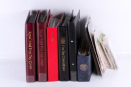 A collection of Great Britain first day covers in six albums plus loose.