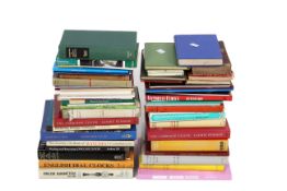 A collection of assorted clock related books.